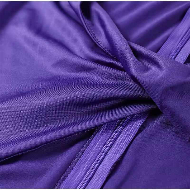 Chic purple dress with deep neckline and waist detail for events and vacation