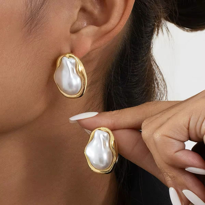 Model wearing ZAYA Baroque Studs – statement gold and pearl earrings, bold and elegant look.