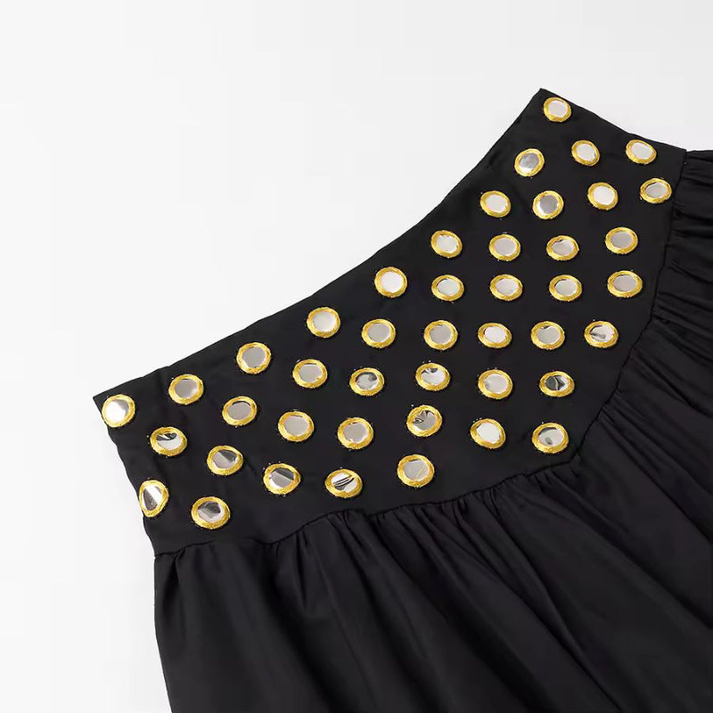 Full-body view of black ruffle crop top with pleated skirt from ZAYA set – sleek & sexy silhouette