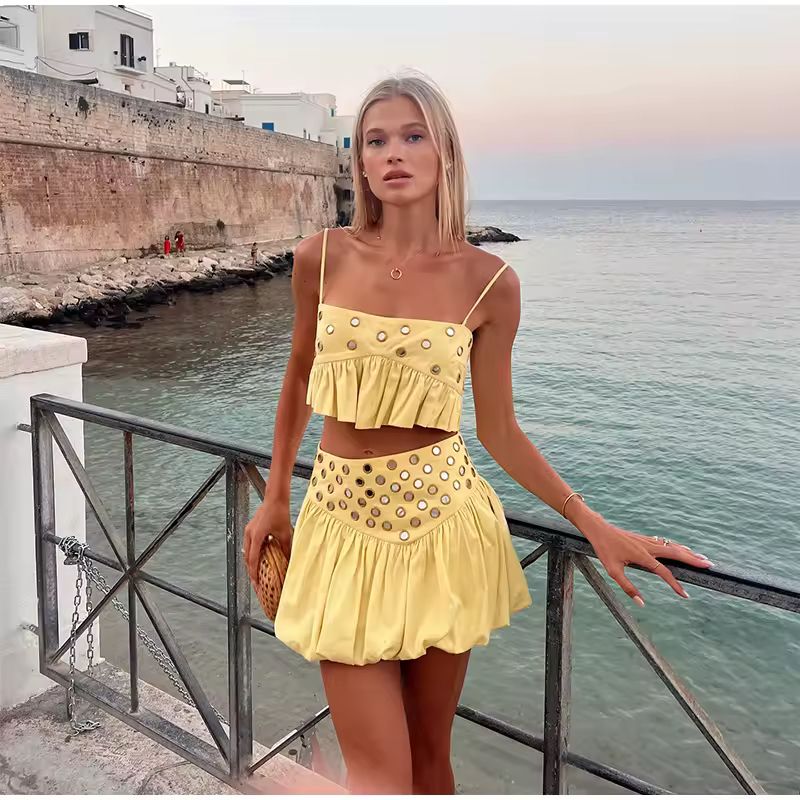 Front view of ZAYA yellow co-ord set with ruffle top and metal ring details – perfect for summer vacation