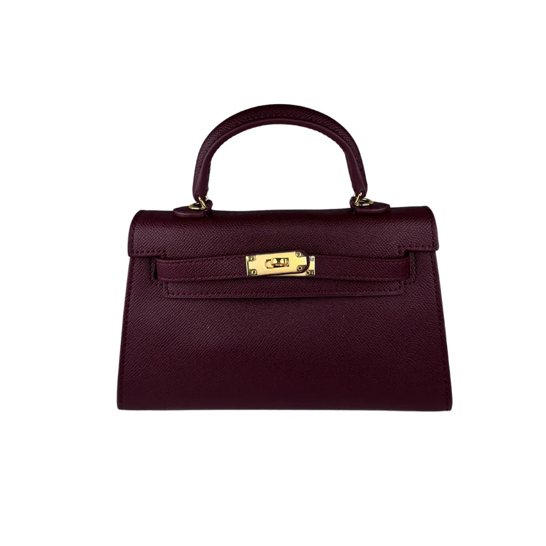 Fleur de Luxe Handbag in chic burgundy, featuring a textured surface and metallic closure