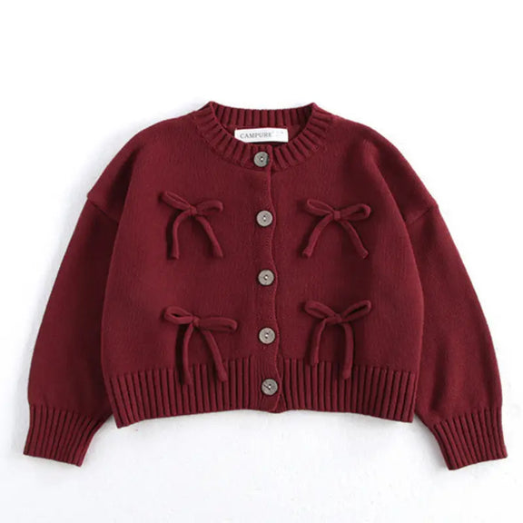 Stylish maroon cotton cardigan for girls, featuring O-neck, long sleeves, ribbed cuffs, and brown buttons. Perfect for fall and winter, available for girls aged 1-6 years in sizes 80-130 cm. Comfortable and fashionable kids’ clothing for cold weather.
