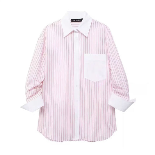 Oversized women’s pink striped button‑down shirt – long sleeves, white contrast collar and cuffs, chest pocket, lightweight poplin fabric, casual summer style.