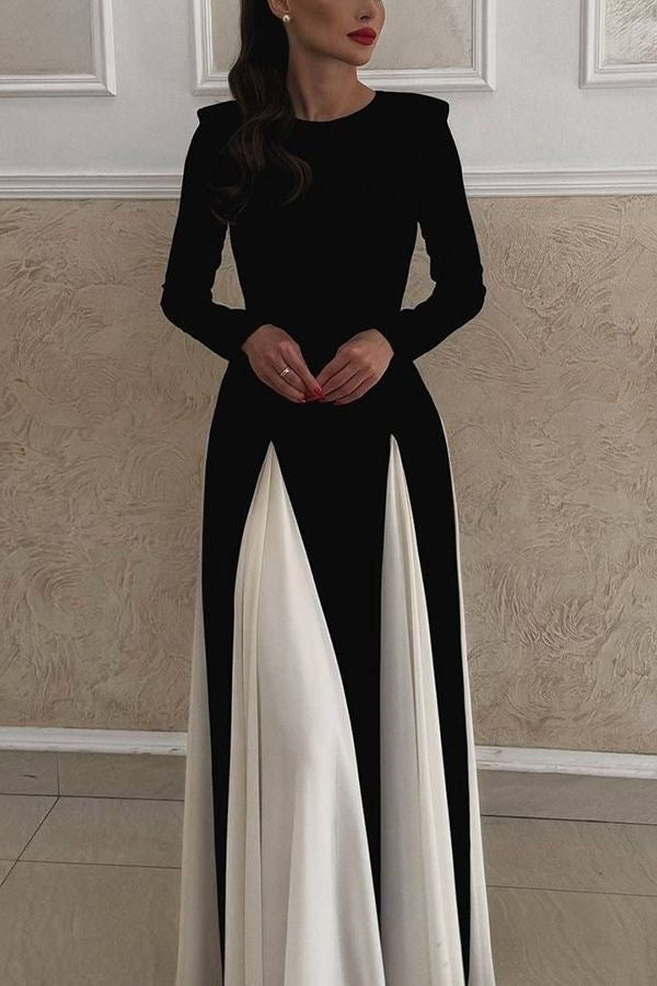 Model wearing a stunning long-sleeved dress for an evening event.