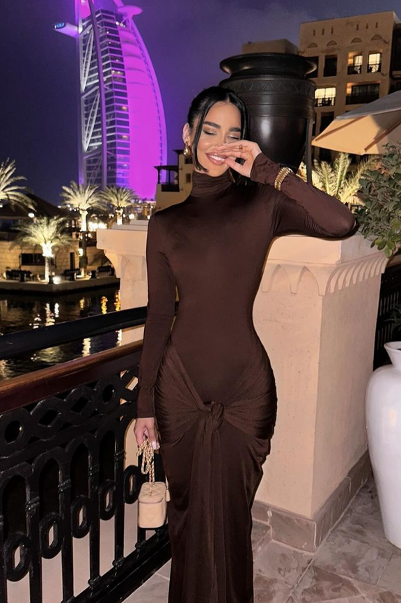 Elegant mocha long sleeve dress with ruched detailing, perfect for sophisticated day and evening wear.