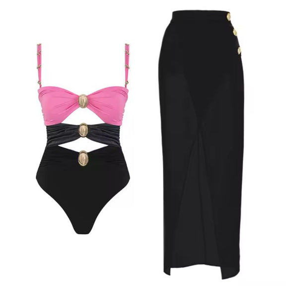 Luxury cut-out one piece swimsuit in bold pink with gold ring details and matching wrap skirt – Chic & Charm beachwear, seamless, wire-free, flattering fit for summer vacation or resort look.