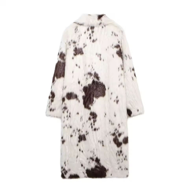 Women’s faux fur coat with brown and white animal print pattern.