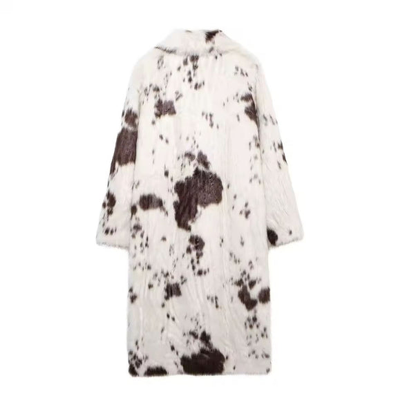Women’s faux fur coat with brown and white animal print pattern.