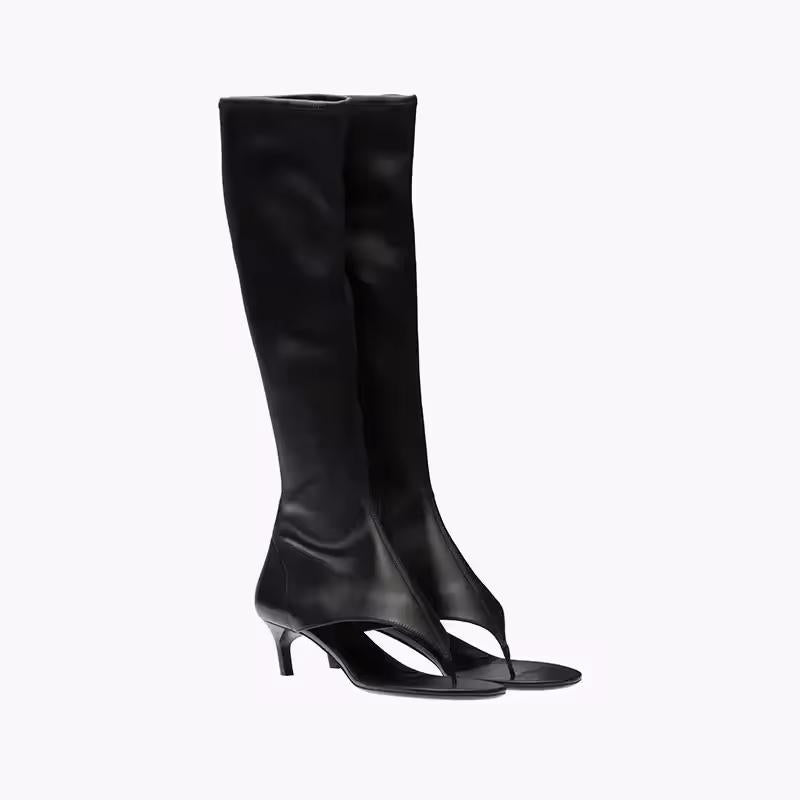 Black knee-high stretch sandal boots for women with 7cm kitten heel and open pinch toe, made from vegan PU leather, shown from the side.
