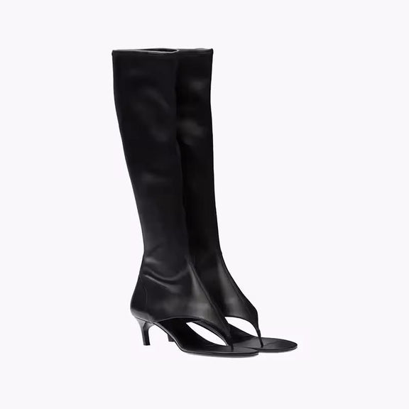 Black knee-high stretch sandal boots for women with 7cm kitten heel and open pinch toe, made from vegan PU leather, shown from the side.
