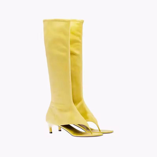 Women’s yellow open-toe sandal boots with thong-style front and slim heel, stylish and breathable for summer wear.
