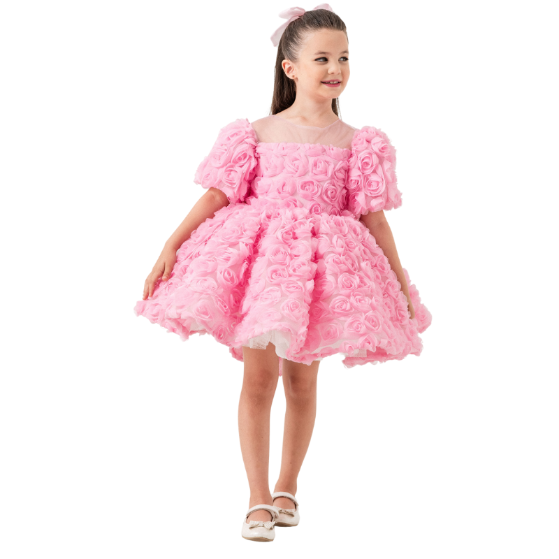 Front view of ‘Aurora Rose’ pink children’s dress with embroidered tulle overlay and back bow, perfect for special occasions. Beautiful