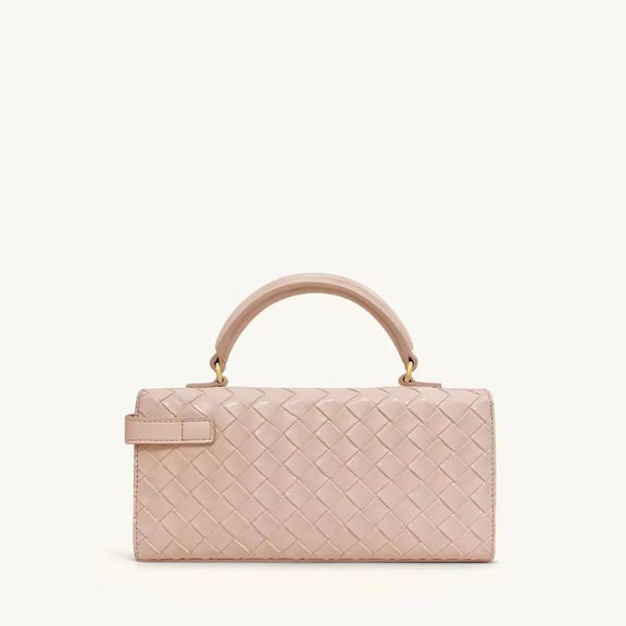 Blush pink designer vegan leather handbag with gold details