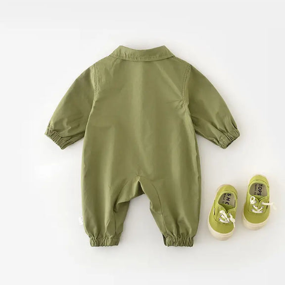 Chic Charm green baby overall with pockets and eye details – soft 100% cotton, hooded, snap button closure, perfect for babies and toddlers.”