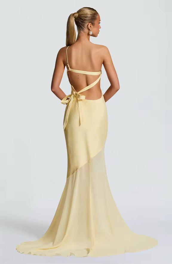 Backless yellow long dress with one-shoulder neckline and floor-length silhouette for special events
