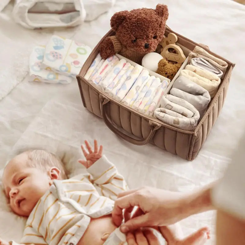 Chic Charm versatile storage bag for baby essentials, made from durable polyester with removable dividers, quilted sides for extra stability, available in various colors and patterns, easy to clean.