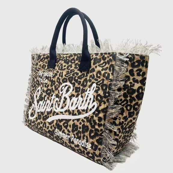 Saint Barth beach bags in hot pink, leopard print, ivory and natural straw – colorful canvas totes with boho vibe for summer 2025.