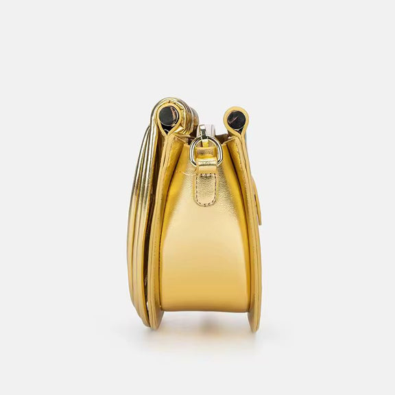 Luxury gold fan-shaped clutch bag Ventaglio d’Oro – structured metallic designer handbag with sculptural design.