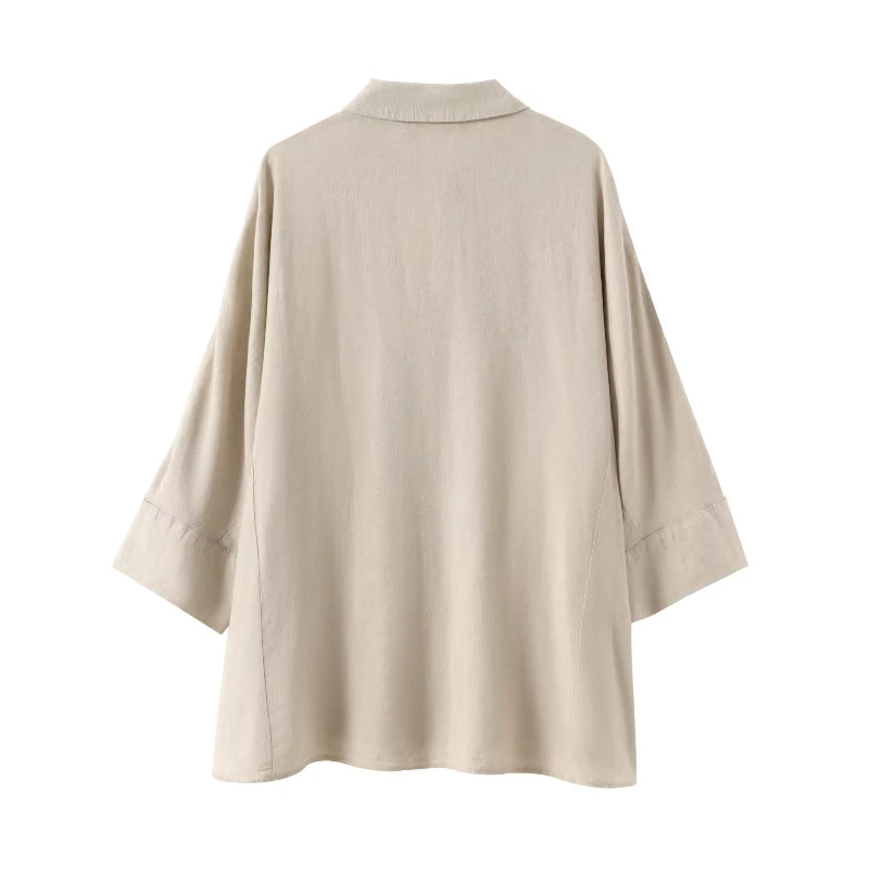 Relaxed-fit beige shirt for women with turn-down collar and 3/4 sleeves – part of coordinated summer set.