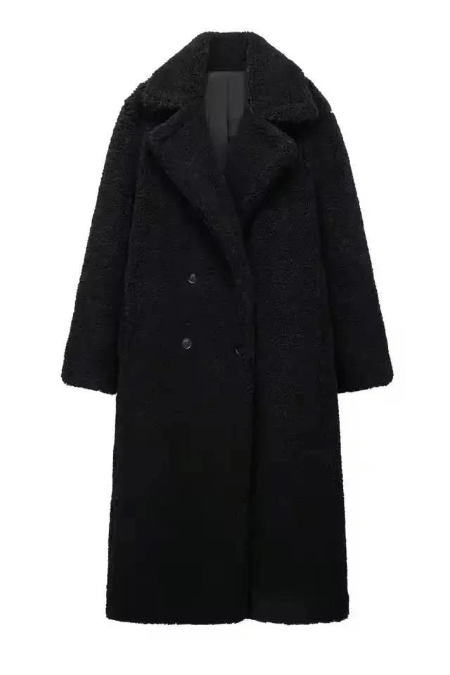 Elegant black long teddy coat for women – thick faux shearling winter coat with double-breasted design and wide lapels.
