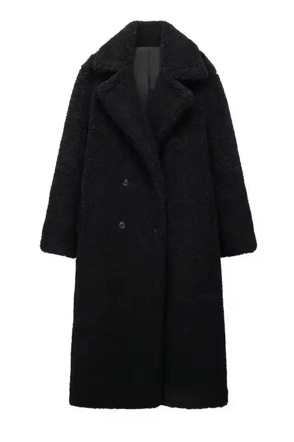 Elegant black long teddy coat for women – thick faux shearling winter coat with double-breasted design and wide lapels.
