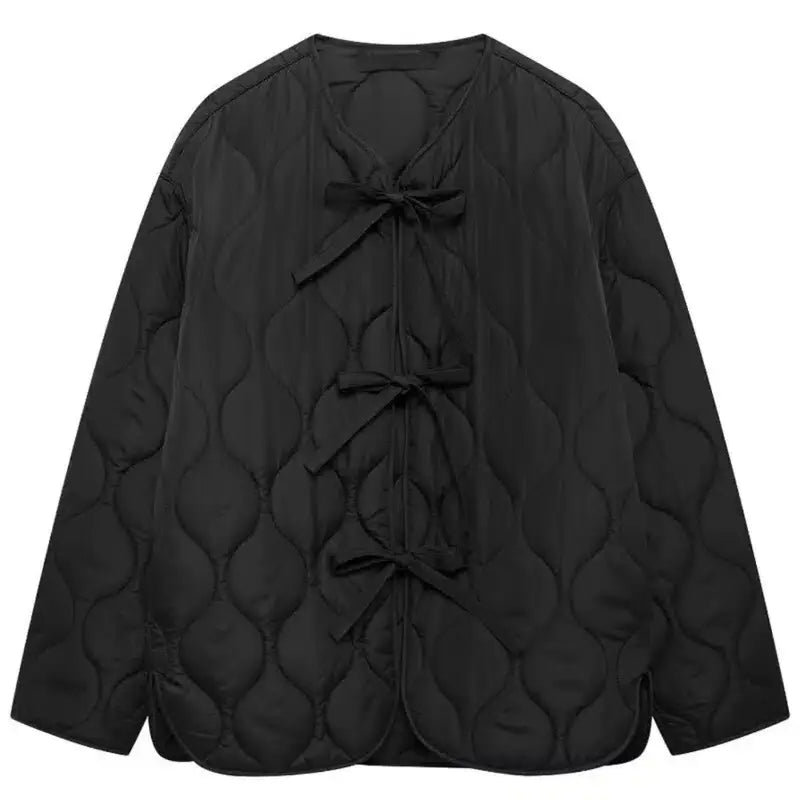 Black quilted jacket with triple ties - stylish outerwear for women
