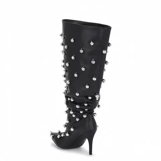 Black knee-high PU leather stiletto boots with metal spike studs, pointed toe and slouch wide shaft.