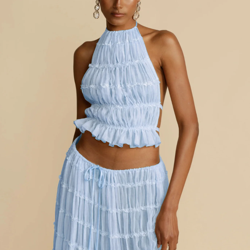 Boho-chic Ibiza dress – 2-piece summer outfit with a flowy pleated maxi skirt and backless halter top, perfect for beach vacations, weddings & festivals.