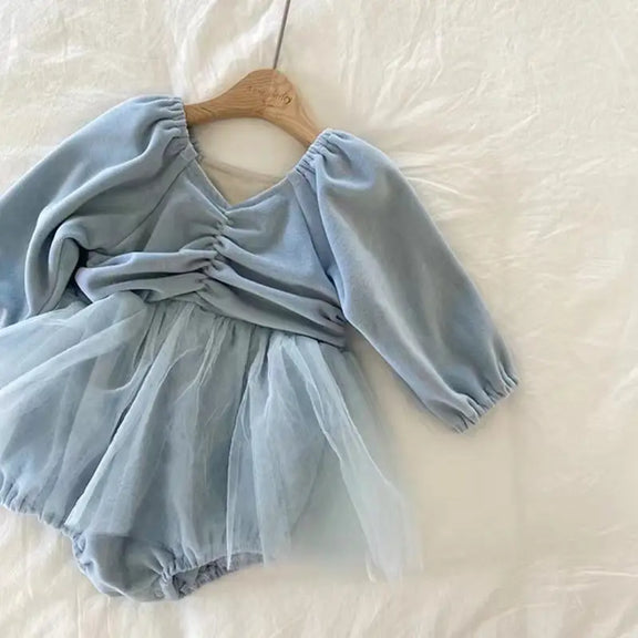 Elegant blue girls’ dress with long sleeves, elastic waist, ruffled skirt, and soft polyester fabric – perfect for comfort and style.