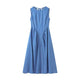 Woman wearing sleeveless backless denim dress with O-neckline – summer 2025 fashion trend
