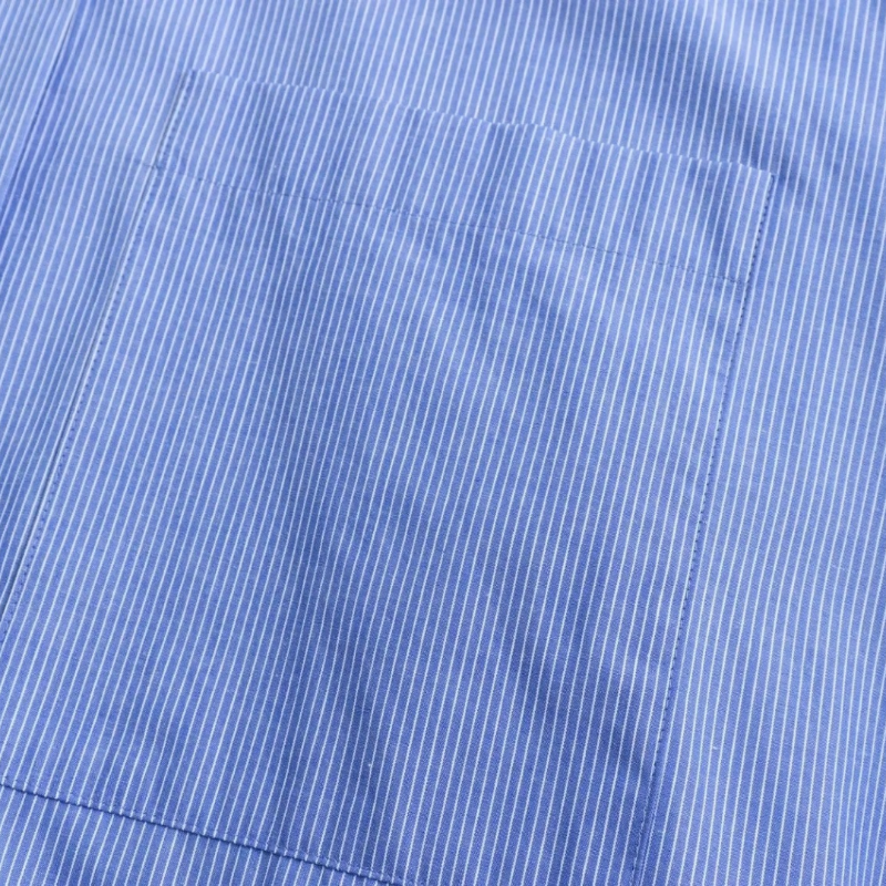 Sky blue striped long-sleeve button-down shirt with chest pocket – lightweight polyester blend, relaxed oversized fit for summer days.