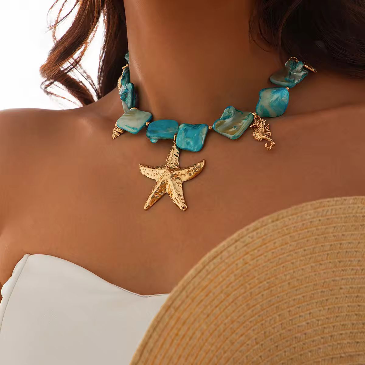 Boho beach necklace worn by woman – ocean-inspired charm jewelry for summer, beach, or festival looks