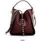 Chic crossbody bag for women featuring genuine leather and edgy studs. Burgundy Red