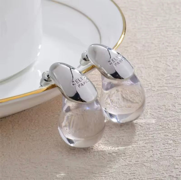 CELISE dome-shaped stud earrings with transparent resin and silver-plated copper – modern fashion jewelry for women in a sleek waterdrop style