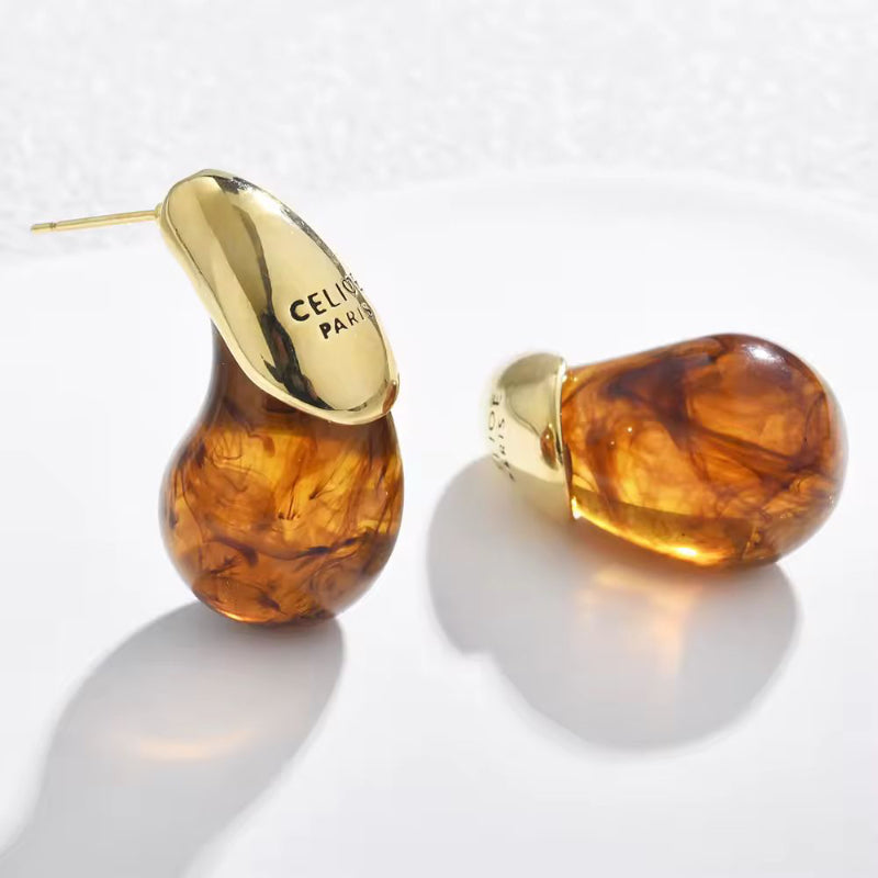 CELISE women’s drop earrings featuring clear resin and gold-plated dome design – stylish minimalist jewelry for everyday and special occasions
