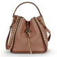 Chic crossbody bag for women featuring genuine leather and edgy studs.