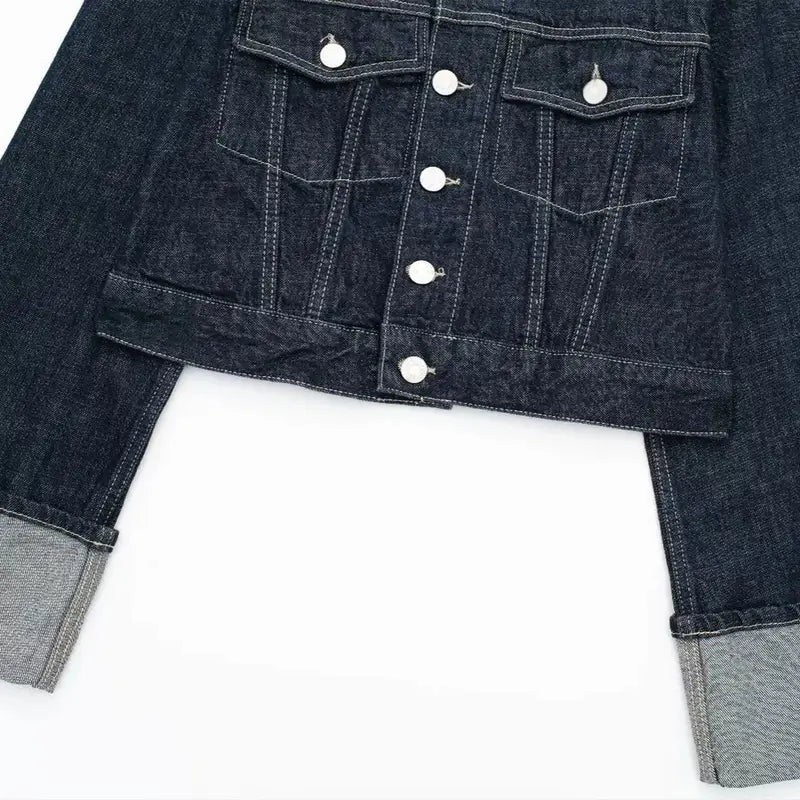 Women’s fashion-forward denim set – dark blue cropped denim jacket with silver buttons, chest pockets & rolled-up cuffs, paired with high-waist wide-leg jeans for a trendy, relaxed street-style look. Premium cotton, perfect for casual, chic & urban outfits.