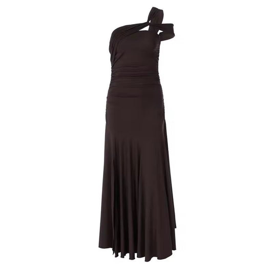 Back view of pleated brown evening dress with cut-out detail and floor-length skirt
	