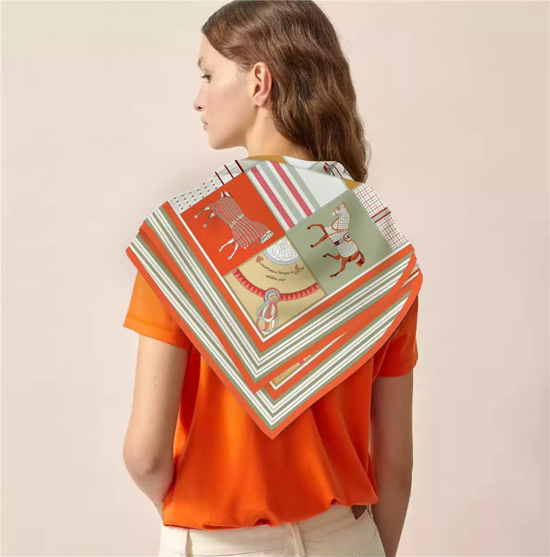 Front view of Equina 90x90 silk scarf with equestrian patchwork in orange tones – luxury neck or head wrap for women
