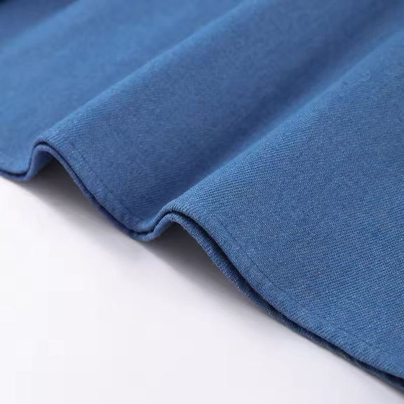 Light blue pleated midi dress flowing in motion – breathable fabric for warm weather
