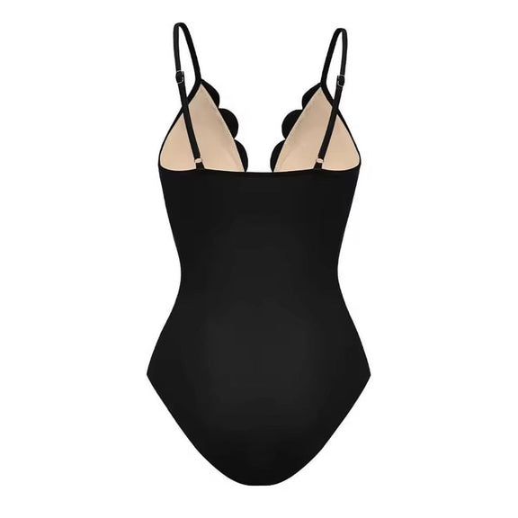 Chic black three-piece women’s set featuring floral laser-cut details – includes a scalloped bodysuit with thin adjustable straps and deep V-neckline, paired with a flowy high-waisted maxi skirt. Made from soft polyester-spandex blend. Perfect for beachwear, resort looks, or elegant summer outfits.