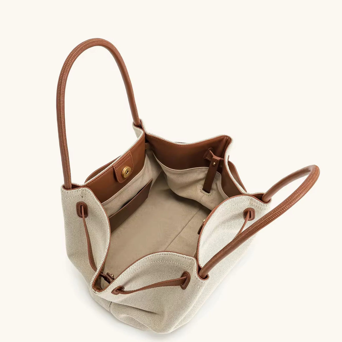 Toscana Tote front view – cream canvas bag with tan leather-look handles
