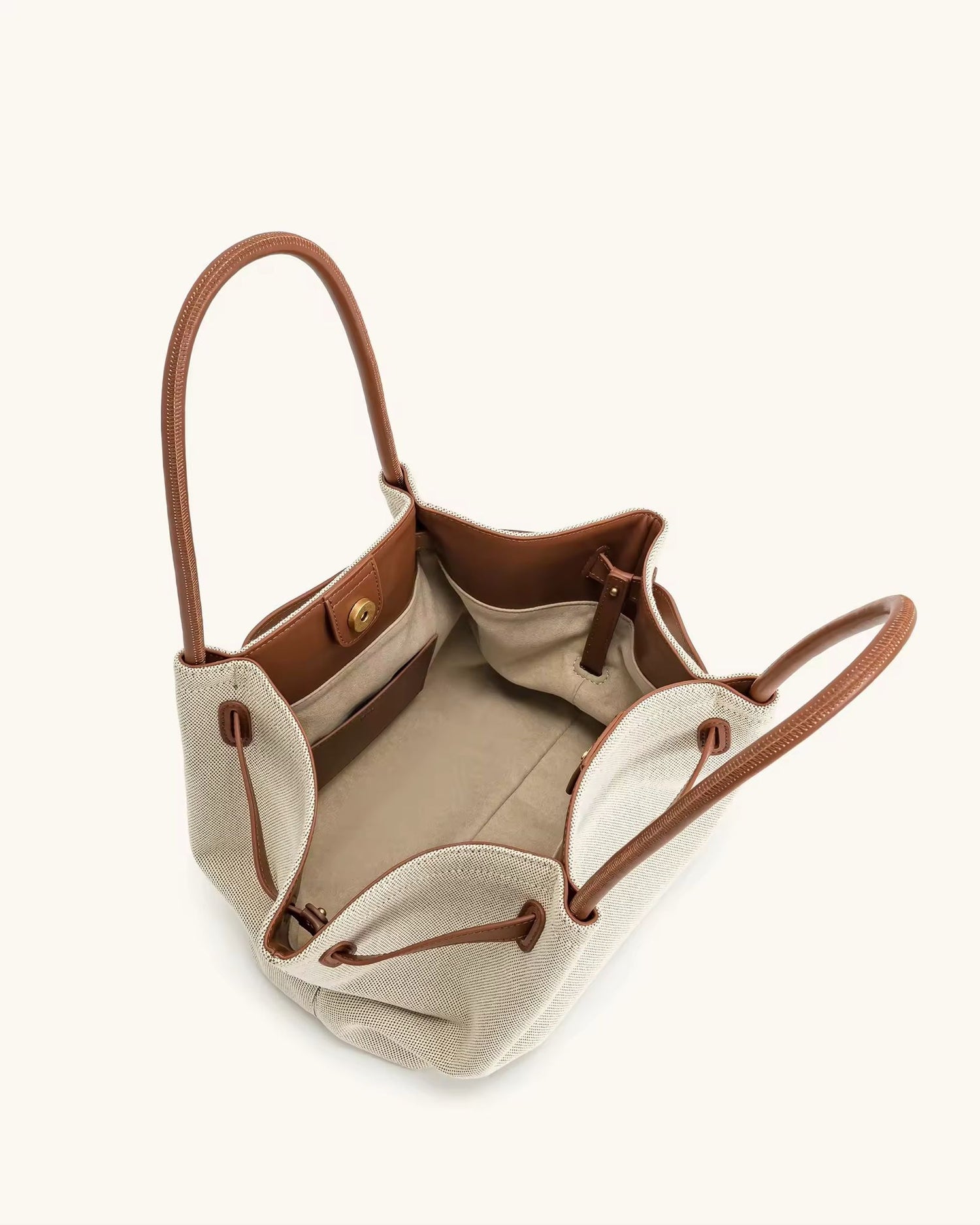 Toscana Tote front view – cream canvas bag with tan leather-look handles
