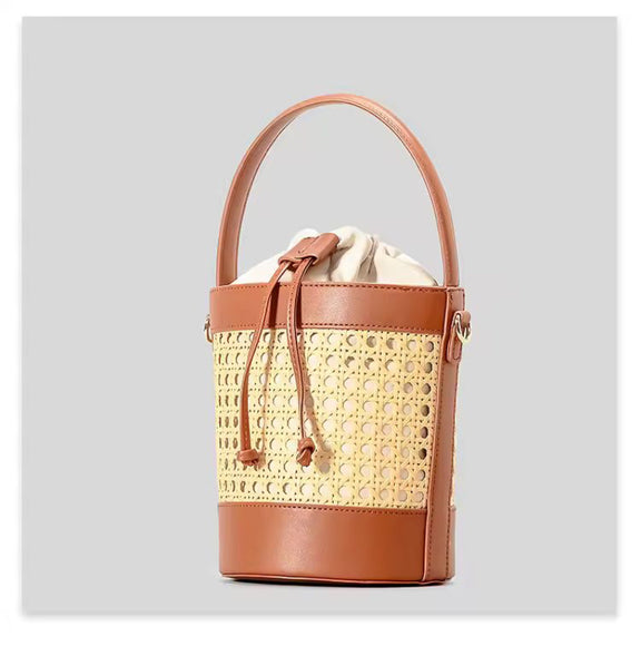 The CORA Straw Shoulder Bag styled on a picnic setup – the perfect accessory for beach days, weekend getaways and vacation looks.
