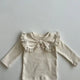 Beige and brown baby tops for girls made from 100% cotton, featuring a decorative bow, lace trims, and floral pattern, perfect for fall fashion and comfortable baby clothing.