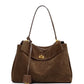 Elegance Suede Handbag is a true masterpiece crafted from high-quality suede, blending luxury and functionality perfectly. Available in two elegant colors – Light Brown and Dark Brown – this exquisite bag features a sophisticated gold buckle, enhancing its design and adding a modern yet timeless look. With generous dimensions of 23 cm x 11 cm x 35 cm, it offers ample space for all your essentials, from smartphones to cosmetics and more, making it the ideal companion for any occasion.

