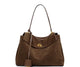 Elegance Suede Handbag is a true masterpiece crafted from high-quality suede, blending luxury and functionality perfectly. Available in two elegant colors – Light Brown and Dark Brown – this exquisite bag features a sophisticated gold buckle, enhancing its design and adding a modern yet timeless look. With generous dimensions of 23 cm x 11 cm x 35 cm, it offers ample space for all your essentials, from smartphones to cosmetics and more, making it the ideal companion for any occasion.

