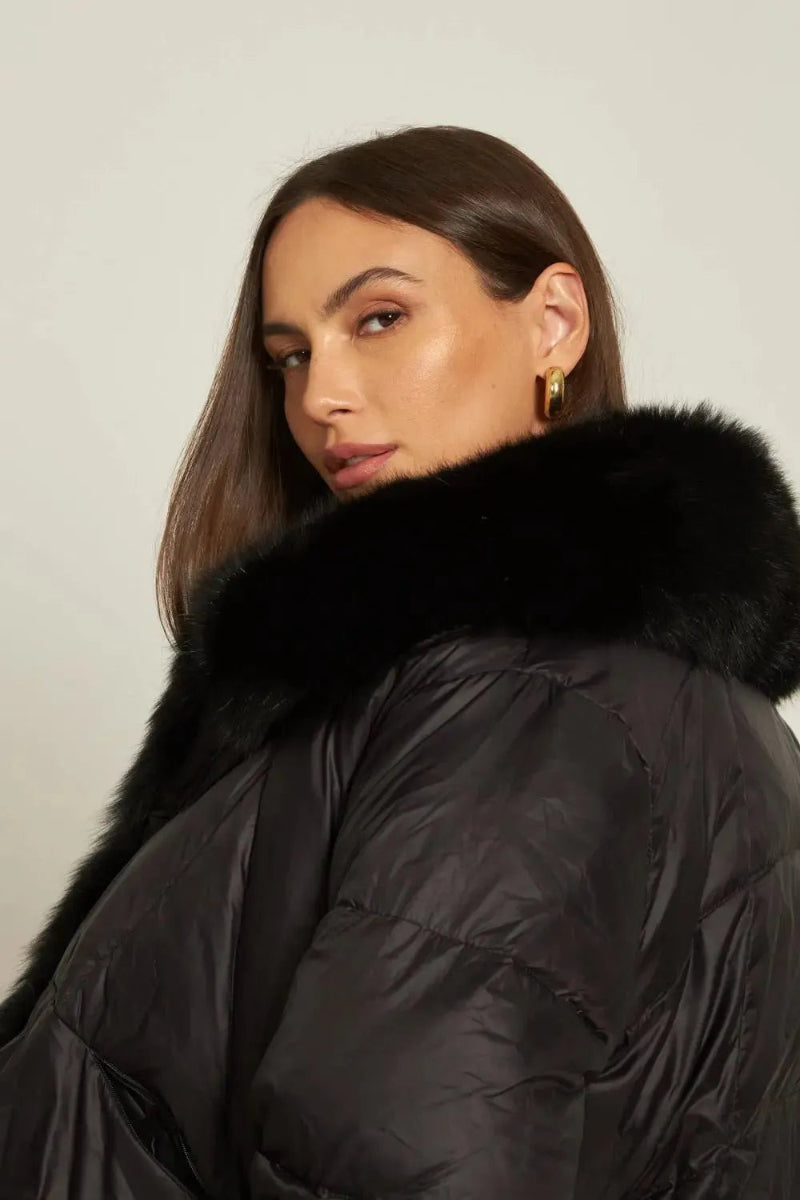 High-quality fabric and label details of Maison de Fox down jacket – premium white duck down filling and real fox fur.