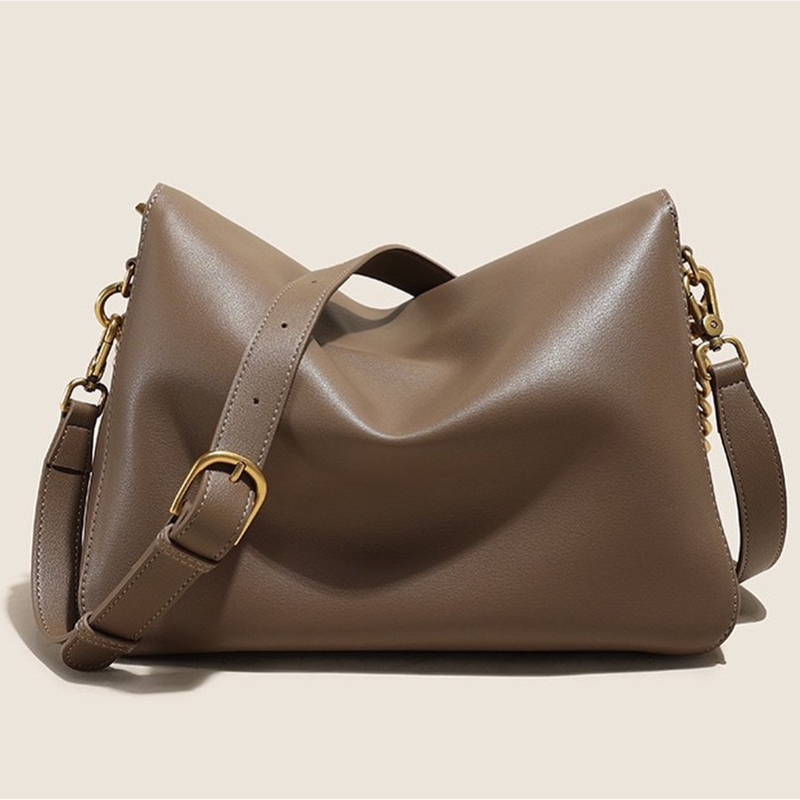 Taupe leather handbag ÉLAN with gold chain strap, handcrafted A-line silhouette, soft cotton lining – luxury everyday shoulder bag.