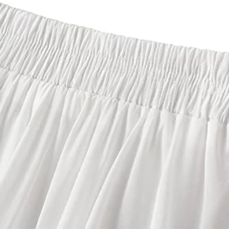 Elegant short tulle skirt with silk-like shorts, A-line fit, elastic waistband, and delicate pleats for a feminine, stylish look. Perfect for parties and special occasions